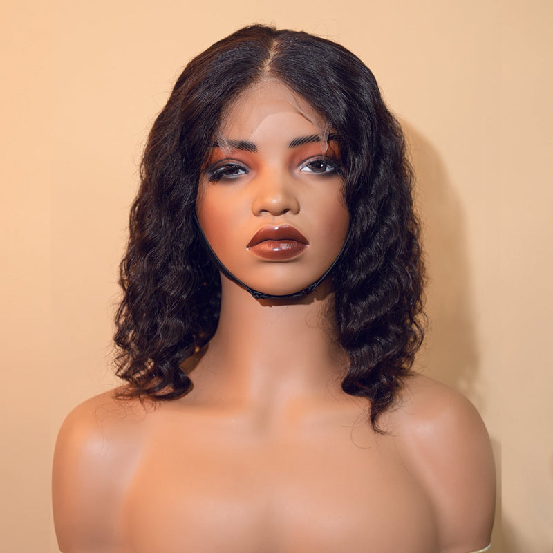 Mannequin head with a black wig on a beige background